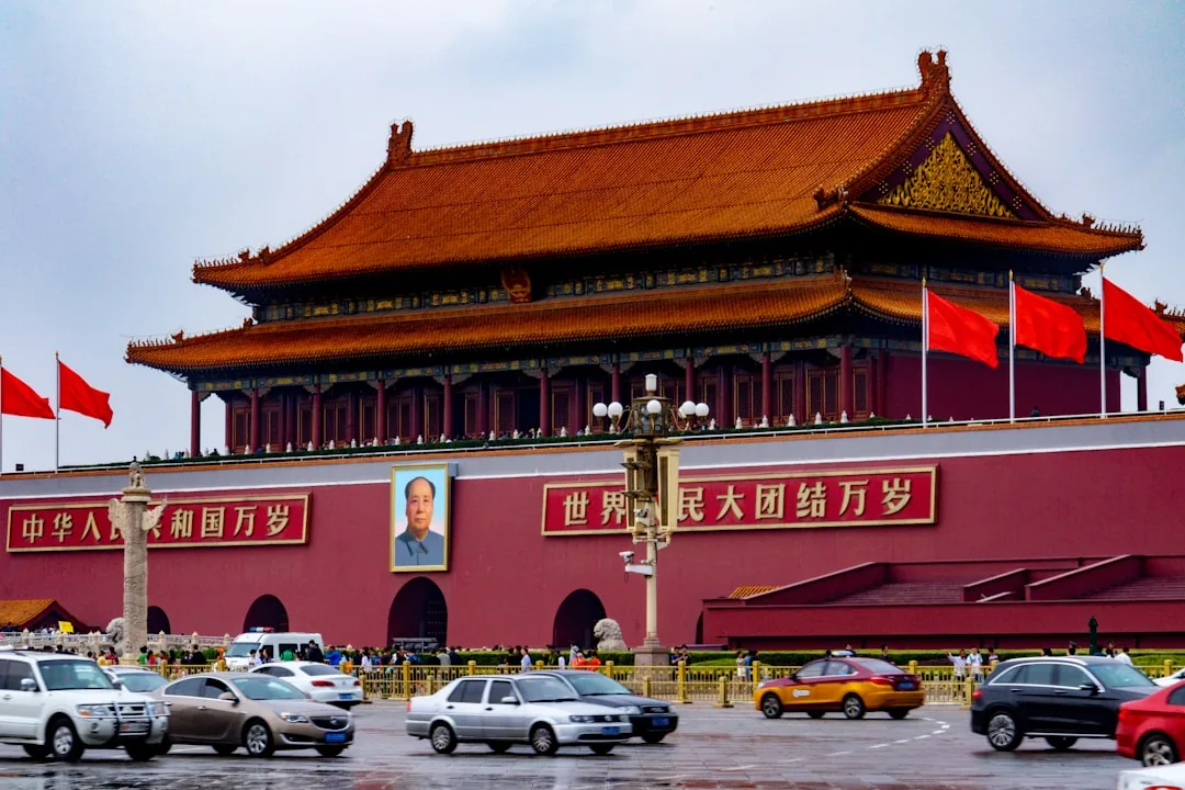 The Tiananmen Gate in Beijing with the iconic Chairman Mao portrait and Chinese inscriptions.