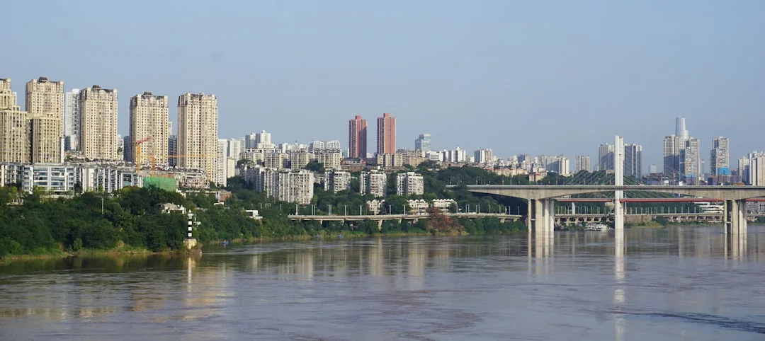 Chongqing skyline and river bridges along the Yangtze River.