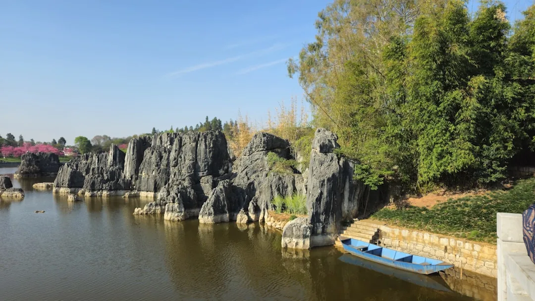 Stone Forest near Kunming with limestone formations beside the water.