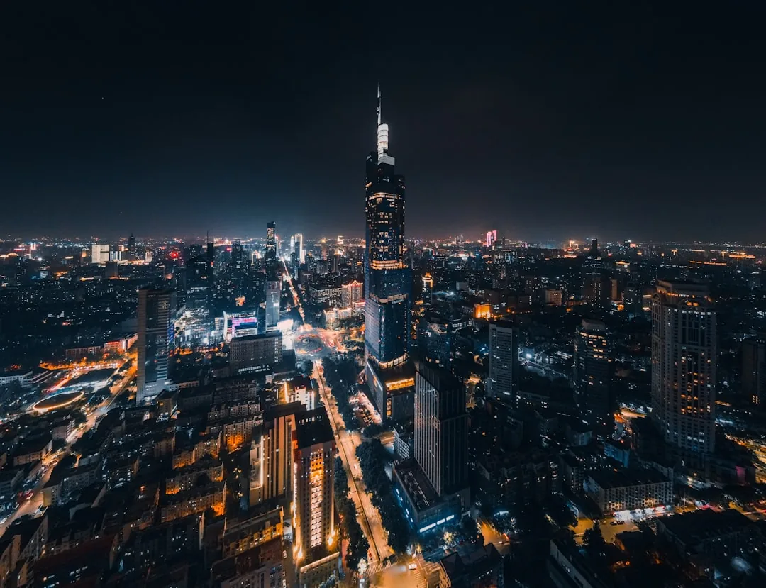 Nanjing city wall and surrounding city lights at night.