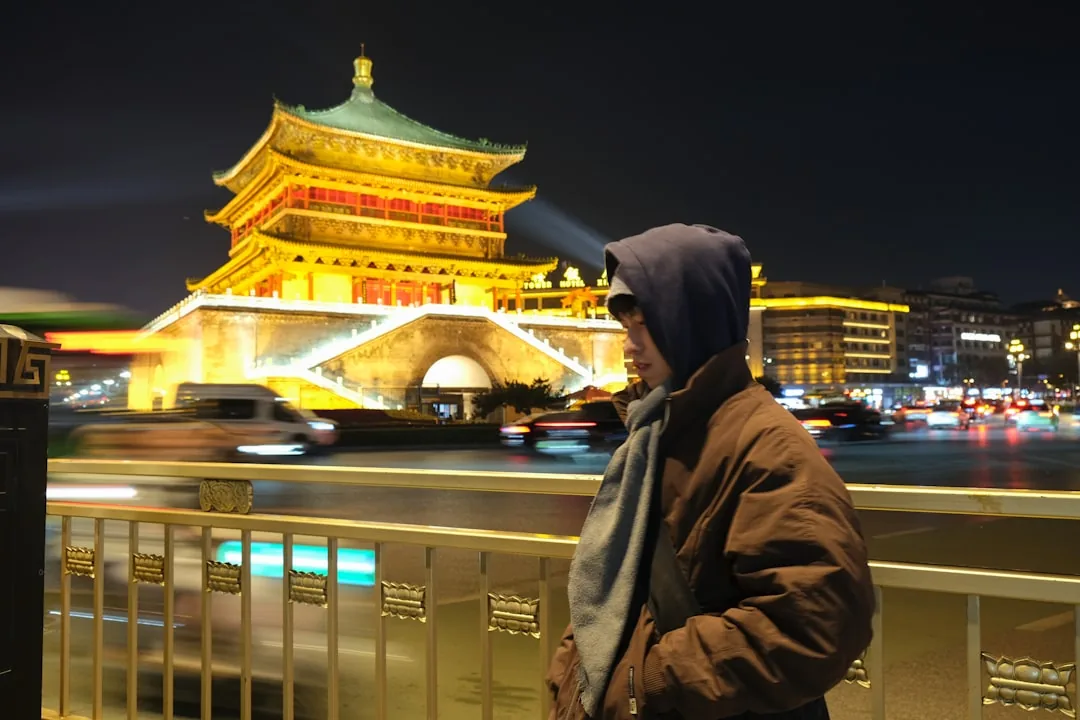 Xi'an Bell Tower illuminated at night in the center of the old city.